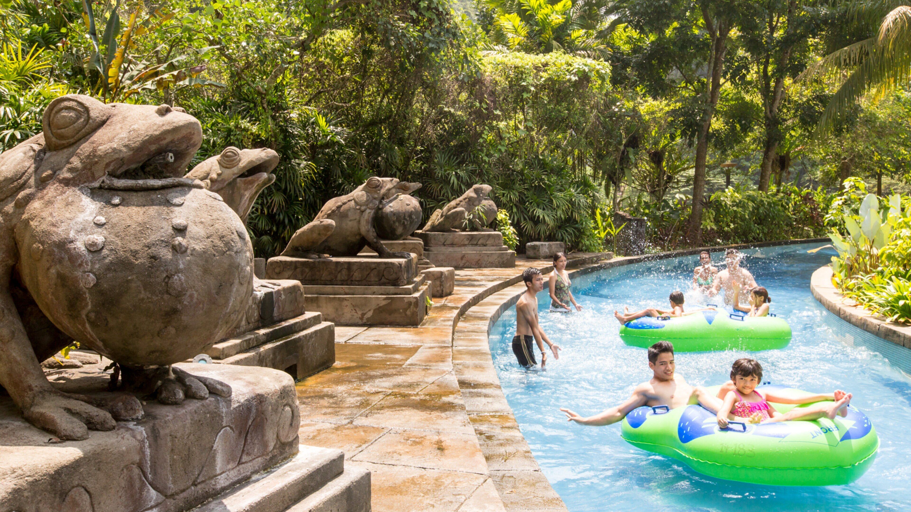 Ipoh showing a waterpark as well as a small group of people