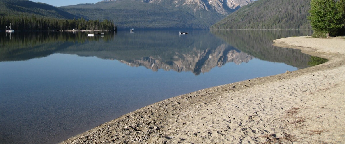 Calm summer morning at Redfish lake. The lake is a good starting point for hiking and backpacking in the Sawtooth mountains.