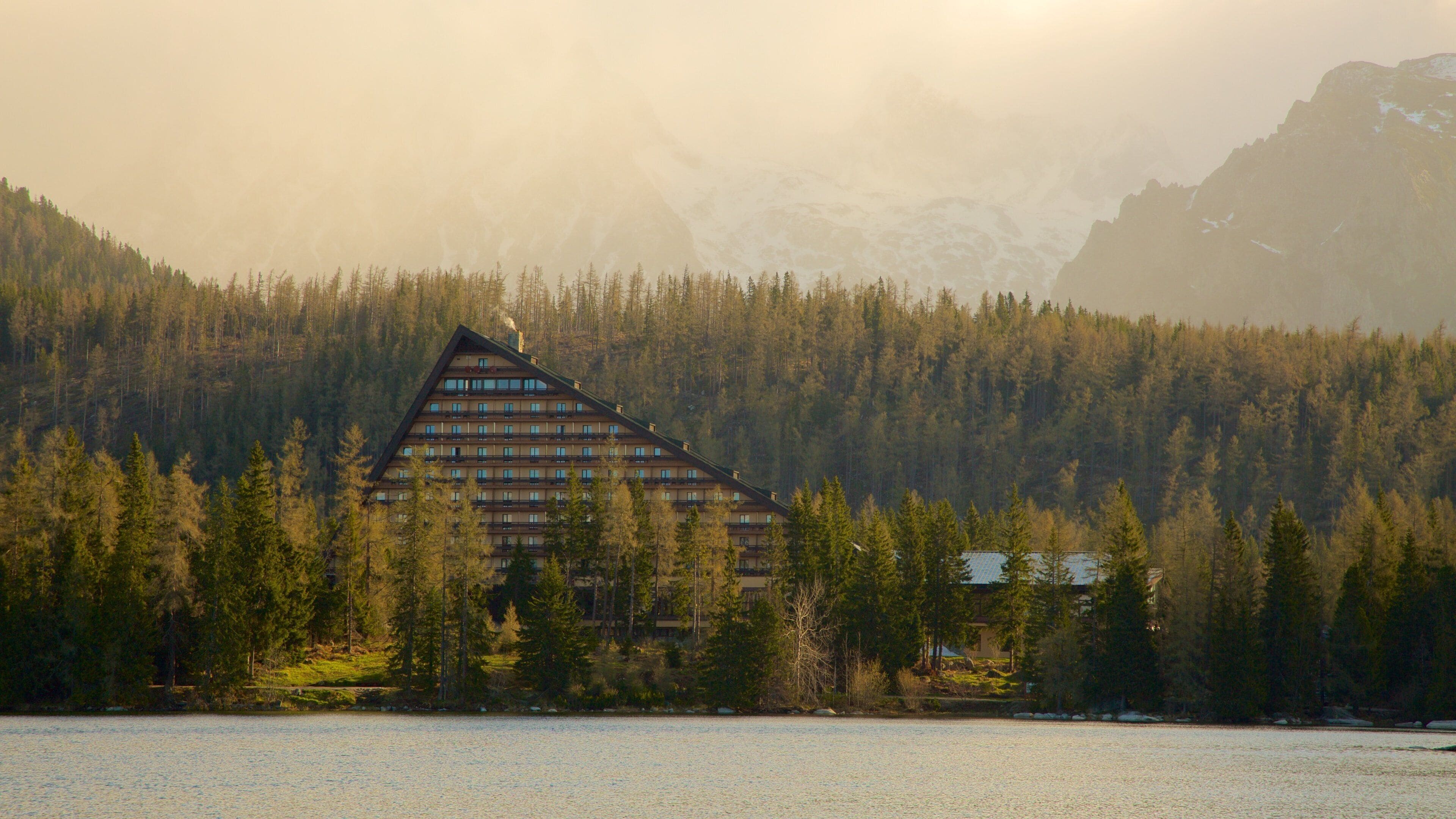 Slovakia which includes a lake or waterhole, a hotel and forests