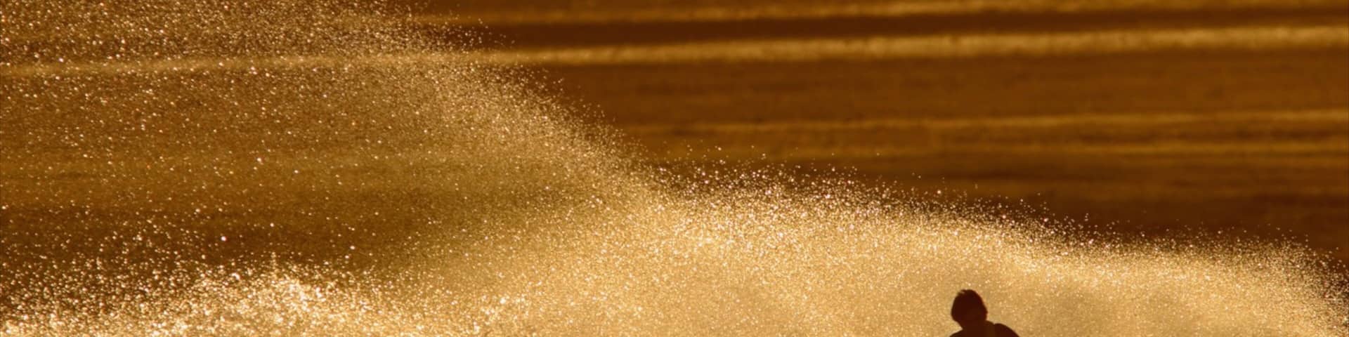 El Centro which includes a sunset and jet skiing as well as an individual male