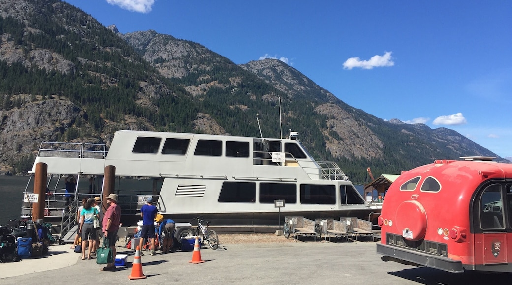 The Lady Express passenger boat is docked for an hour layover at Stehekin after a fifty-five mile journey to the head of Lake Chelan. A North Cascades National Park bus provides transportation to the park nine miles away. No roads lead to Stehekin.
