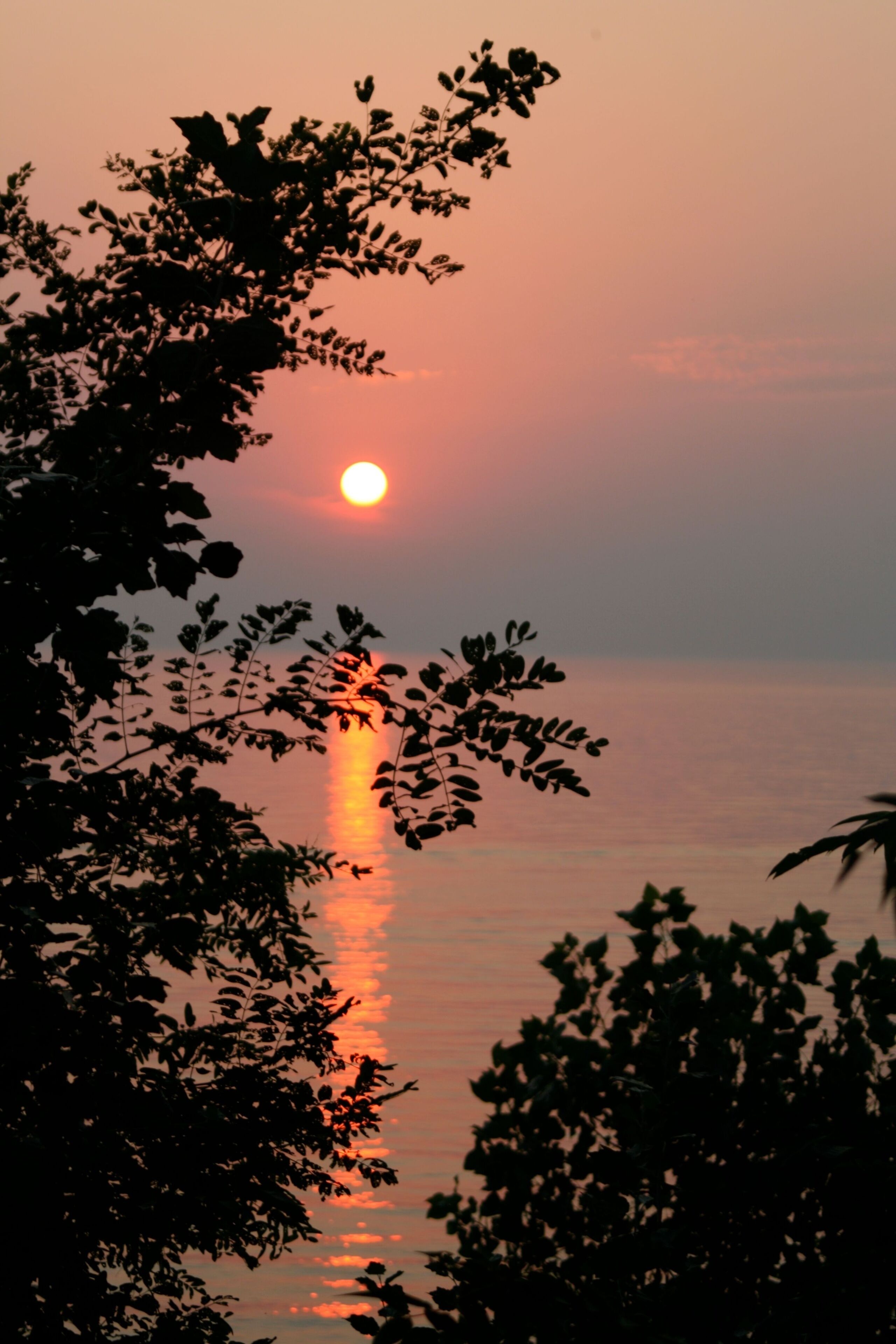Vertical shot of sunset on the Lake Michigan, view from Glenlord Beach, Stevensville, MI