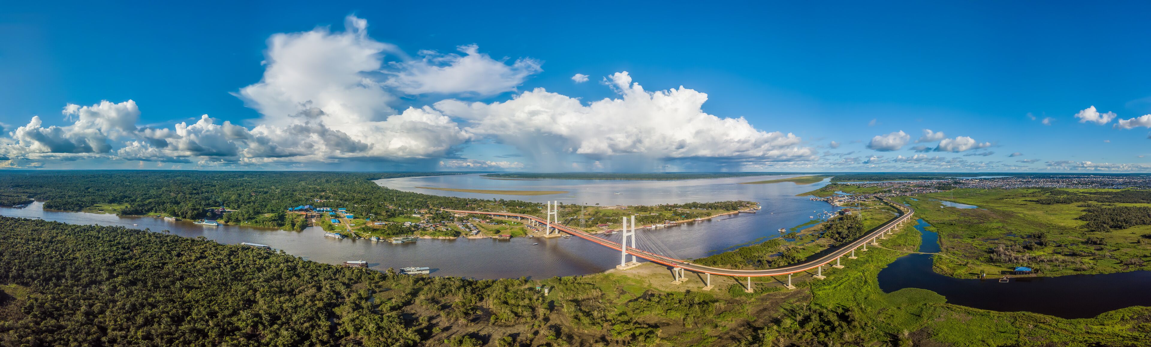 The Nanay, a tributary of the Amazon, joins the Amazon River under the sun