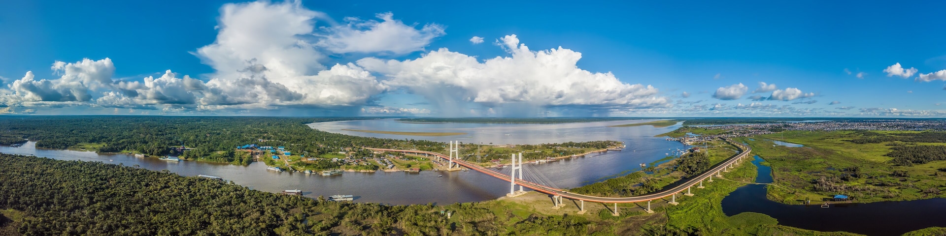The Nanay, a tributary of the Amazon, joins the Amazon River under the sun