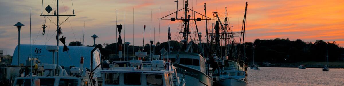 Stonington showing a sunset and a bay or harbor