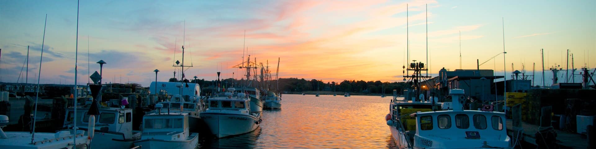 Stonington which includes a bay or harbour and a sunset