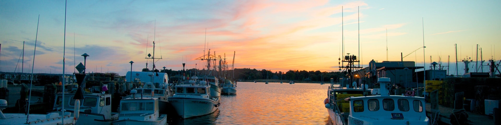 Stonington which includes a sunset and a bay or harbor