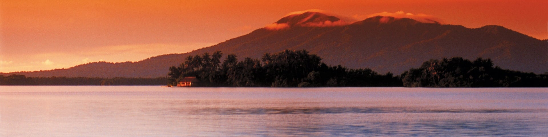 Solomon Islands showing a sunset, general coastal views and mountains