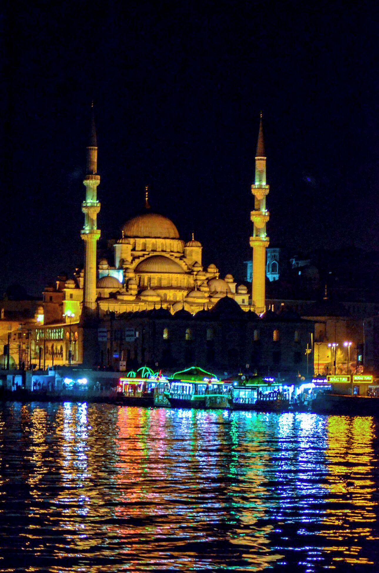 Istanbul at night viewed from the Golden Horn and Bospherus.