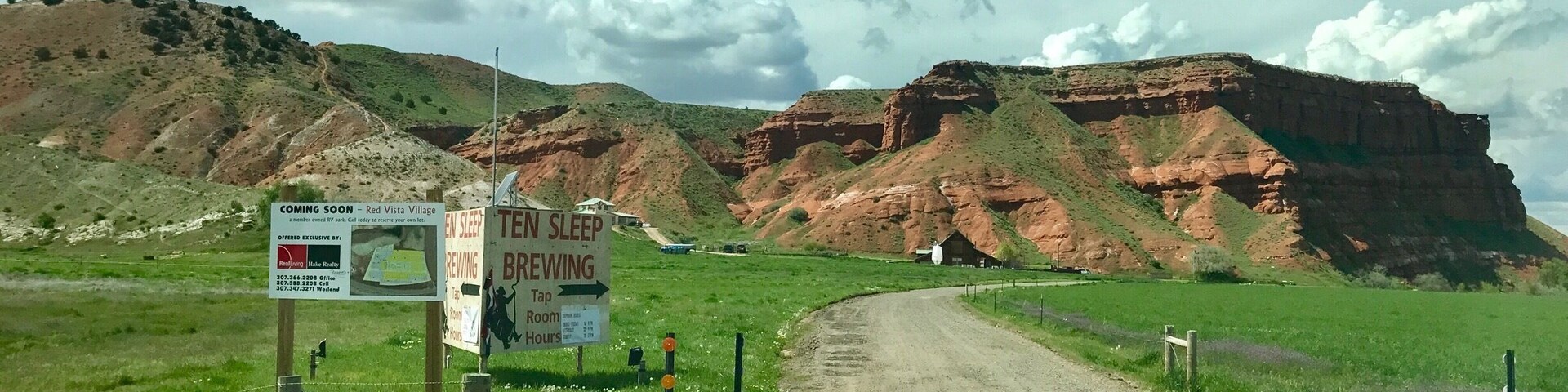 There is a tiny brewery built right at the base of this red rock formation. If you take state route 16 between Bighorn National Forrest and Buffalo Bill State Park, you will drive through the tiny "town" or Ten Sleep. By the time you get to the brewery there is literally nothing around but fields and open plains. As you can see in the picture, you have to cross a cattle grate to drive up the driveway. The brewery had recently changed its hours and turned out to be closed when we arrived. The incredibly nice owners welcomed us in for a brief tasting and growler fill as they happened to be in the tasting room doing paperwork when we walked in. They brewed a variety of styles, but they nailed the flavor of the American style light beer you wouldn't generally associate with the craft beer movement. The interior decor was what you would expect from a bar in Wyoming (antlers and taxidermy items hanging on the walls). No hipster influence at this brewery. #troveon #craftbeer #brewerytourism