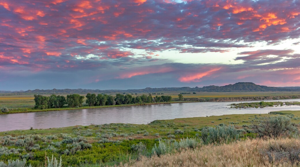 Sunrise and clouds over the Yellowstone River at the confluence with the Powder River near Terry, Montana, USA