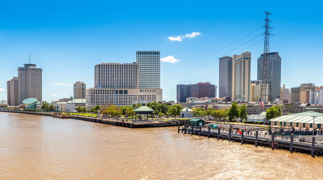 New Orleans city panorama from Mississippi River with business district skyscrappers and river promenade, Louisiana, USA