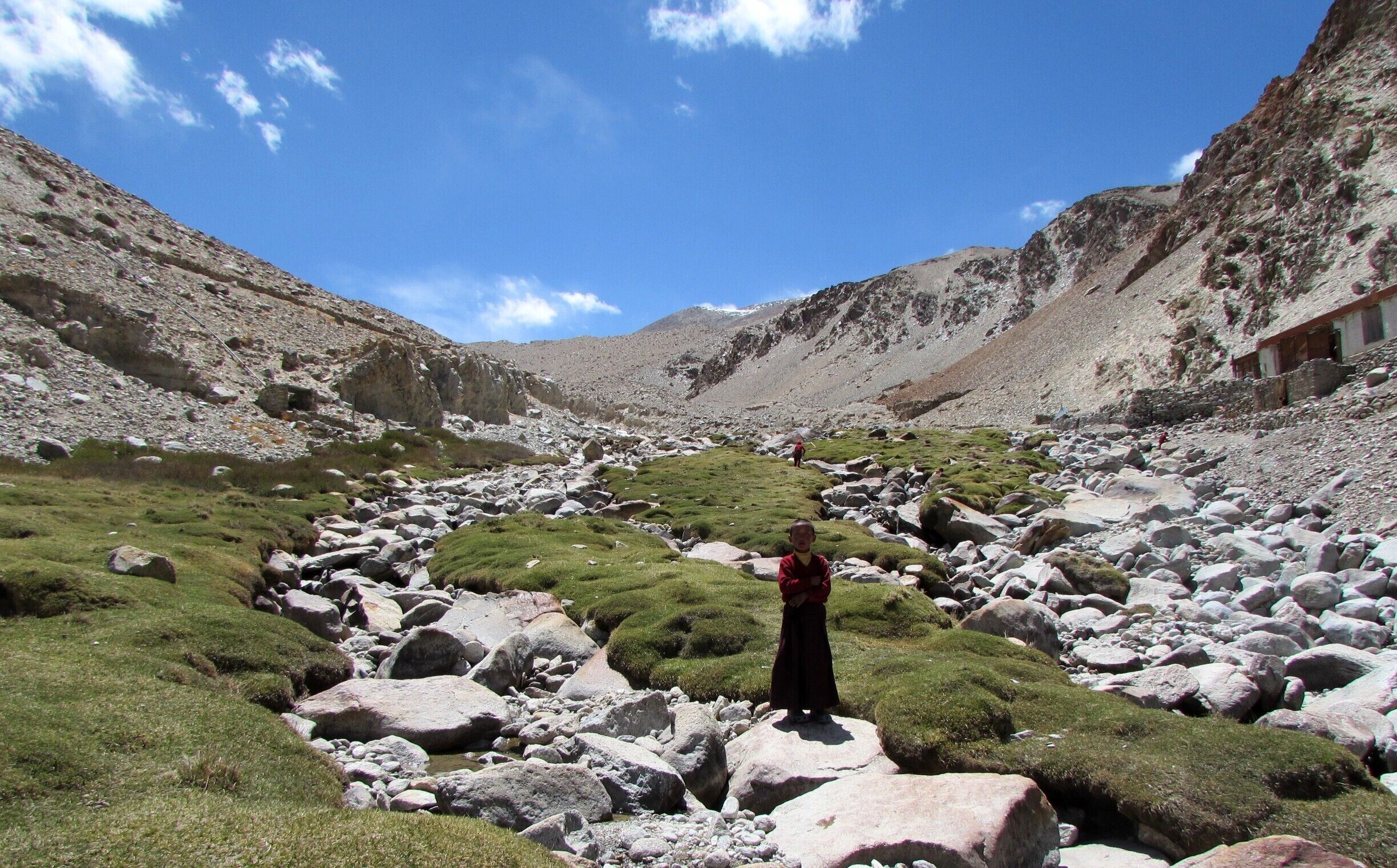 Phuntsok, aged 10, a monk in training has grown up in a remote nunnery in Ladakh's cold desert, located at a 3 hour walk from an off the map village called Skidmung at the base of a glacier, 15000ft above sea level. In its short summer, the white is replaced by green and the melting ice flows
The nunnery gets its name from the village below, and in Ladakhi Skidmung translates to 'too much happiness'.