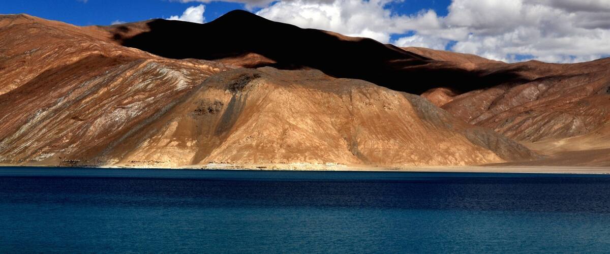 Leh featuring mountains and a lake or waterhole