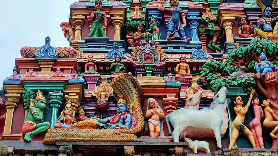 A colorful temple with intricate carvings and statues.