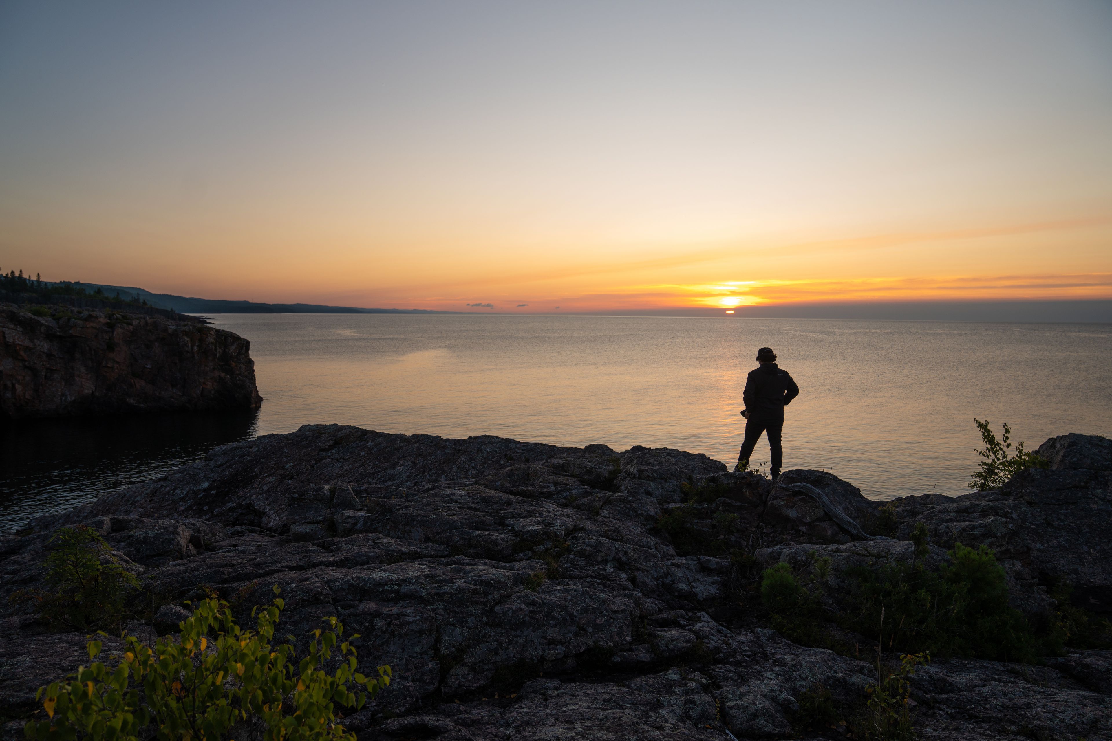 Person Enjoying Sunset by Lake Superior, Minnesota