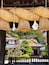 A traditional Japanese building with a thatched roof and wooden beams.