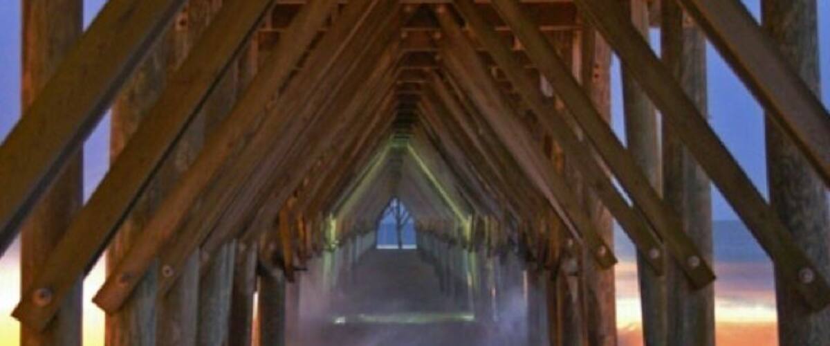 Under the pier at night.