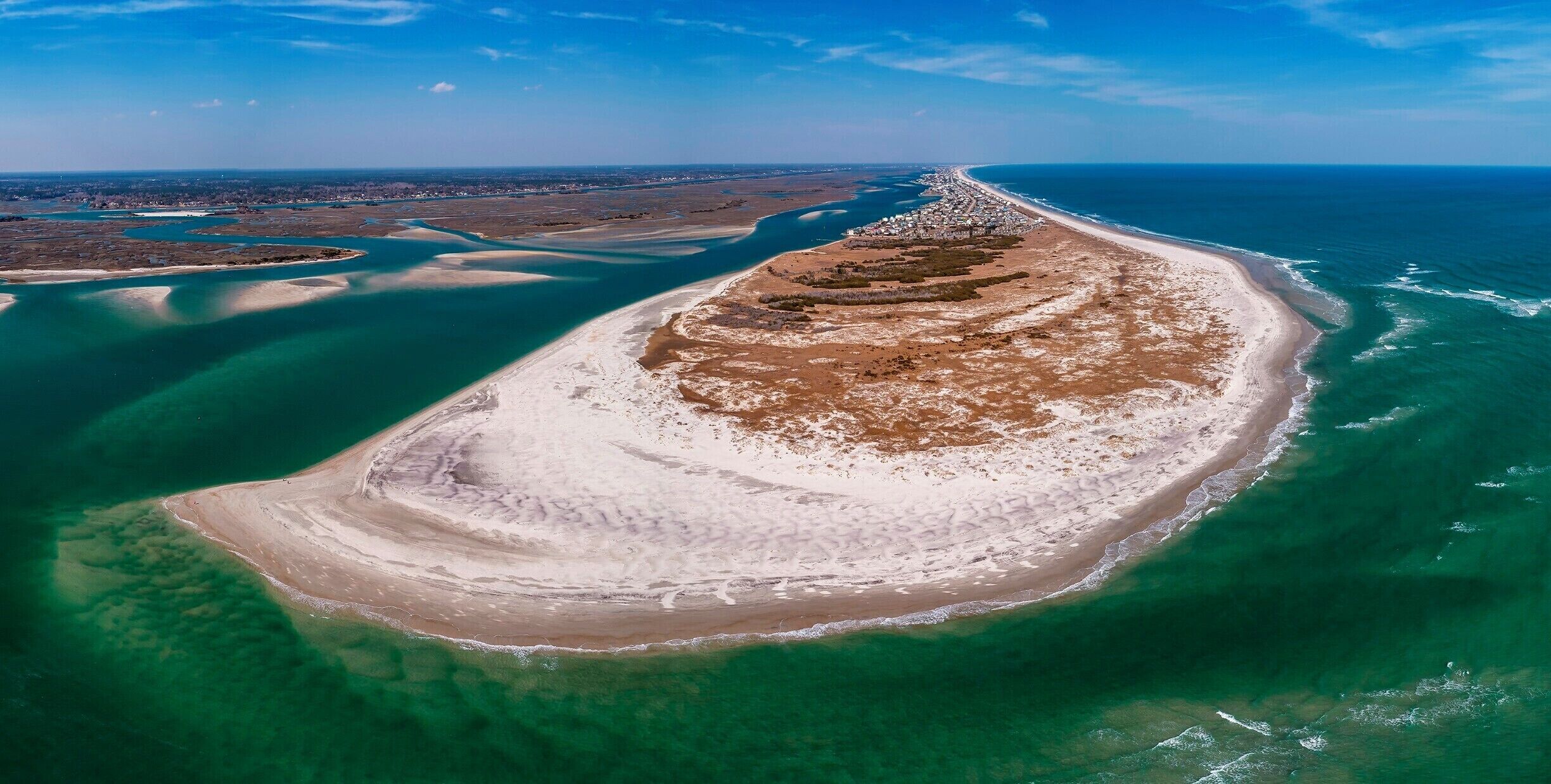 I posted a photo of the south end a few moths back. I thought it would be interesting to show the changes that can occur over just a few months to the sand, island, depth of the water, and water color. 