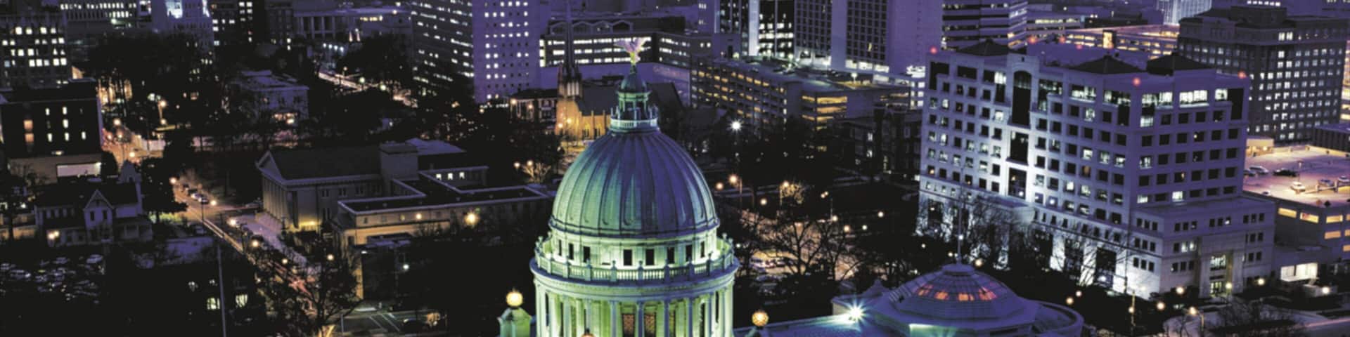 Jackson featuring night scenes, cbd and a city