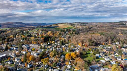 Aerial photo of fall foliage surrounding the Village of Tully, Onondaga County, New York State, October 2024.