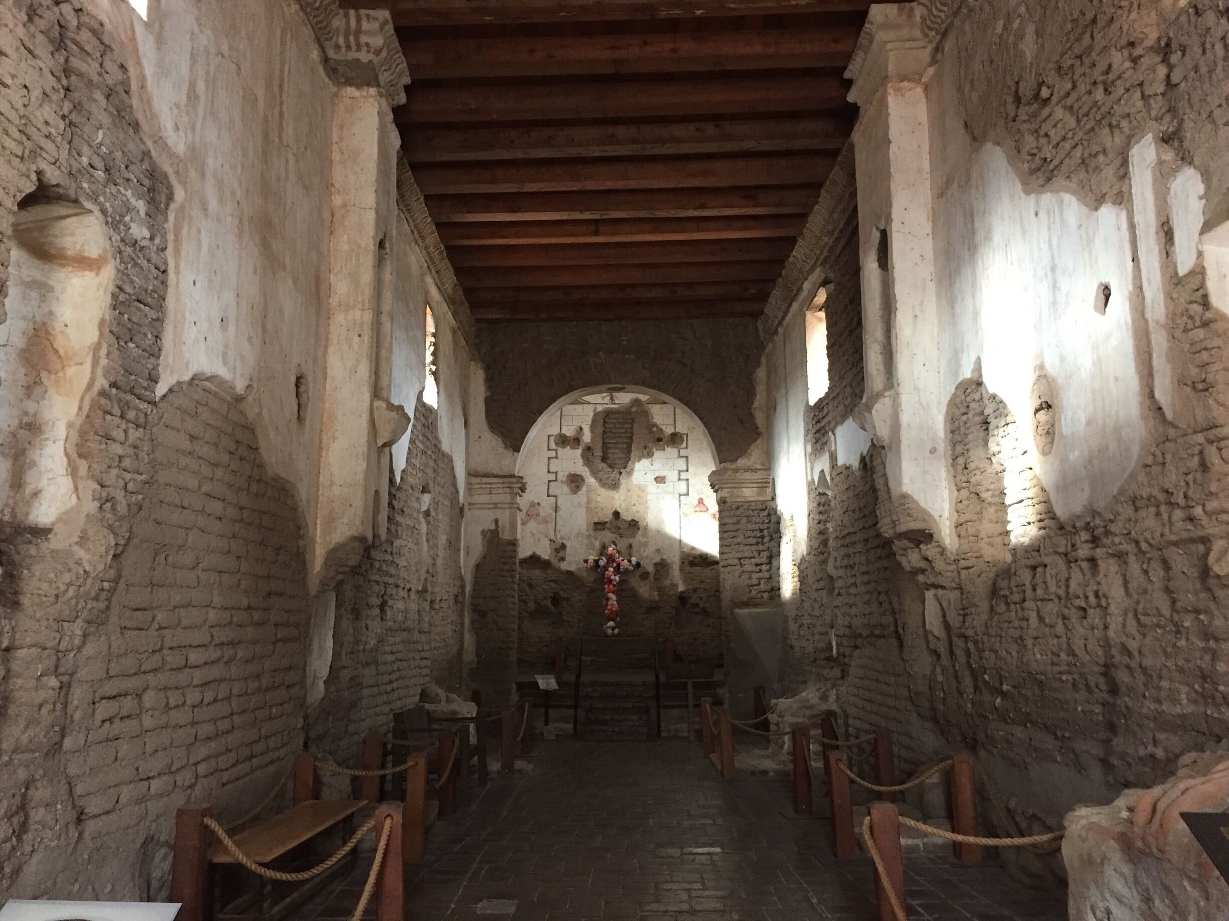 Interior of the Church. In its time it would have been completely covered in white stucco and brightly painted. There were no pews as parishioners would have to stand or kneel during services. 