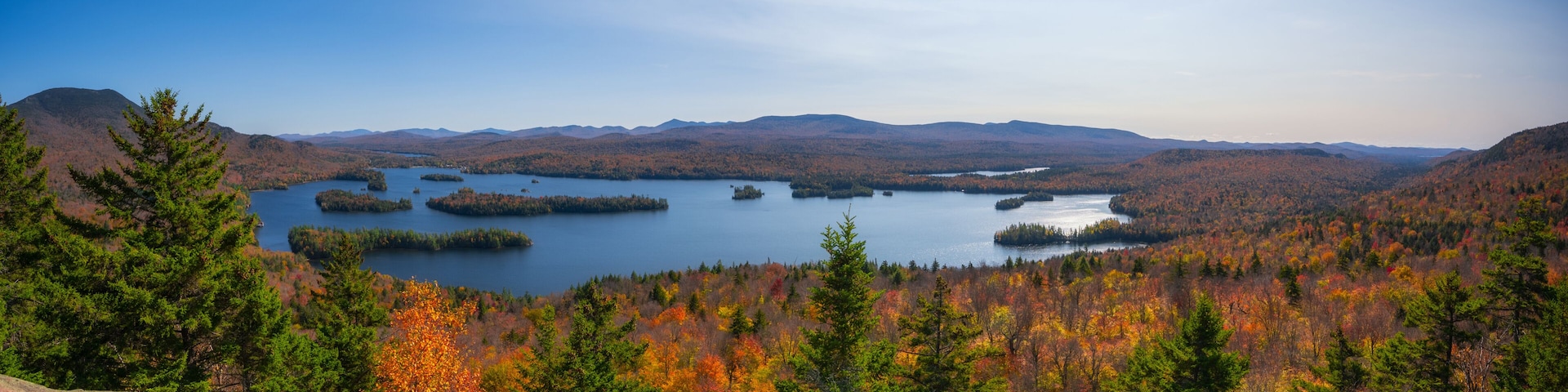 Panorama of the fall foliage and Tupper lake from Castle Rock summit in the Adirondacks New York