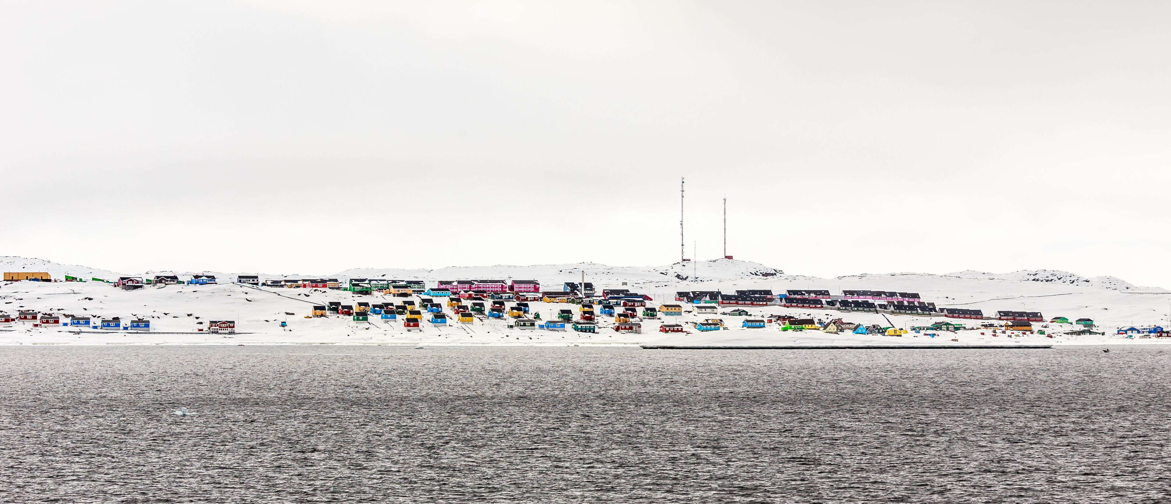 Above the Northern Polar Circle, Colorful Aasiaat city in the mi