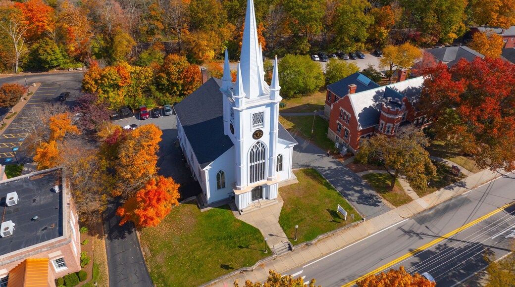 Unitarian Church aerial view in fall with fall foliage at 21 N Main Street in historic town center of Uxbridge, Massachusetts MA, USA.