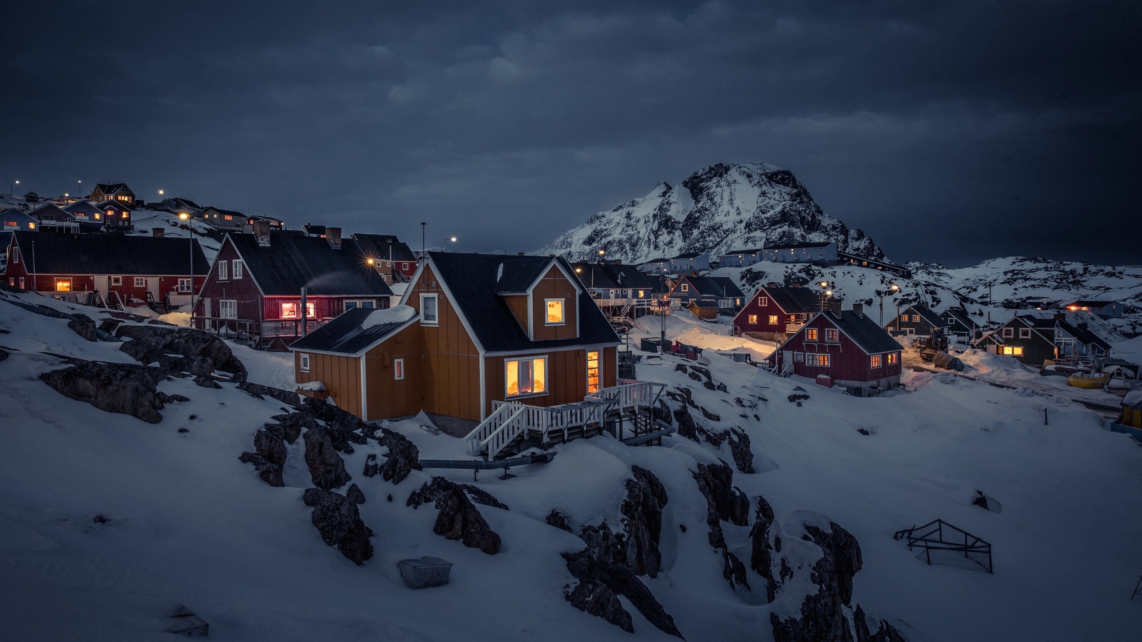 Sisimiut featuring snow, night scenes and mountains