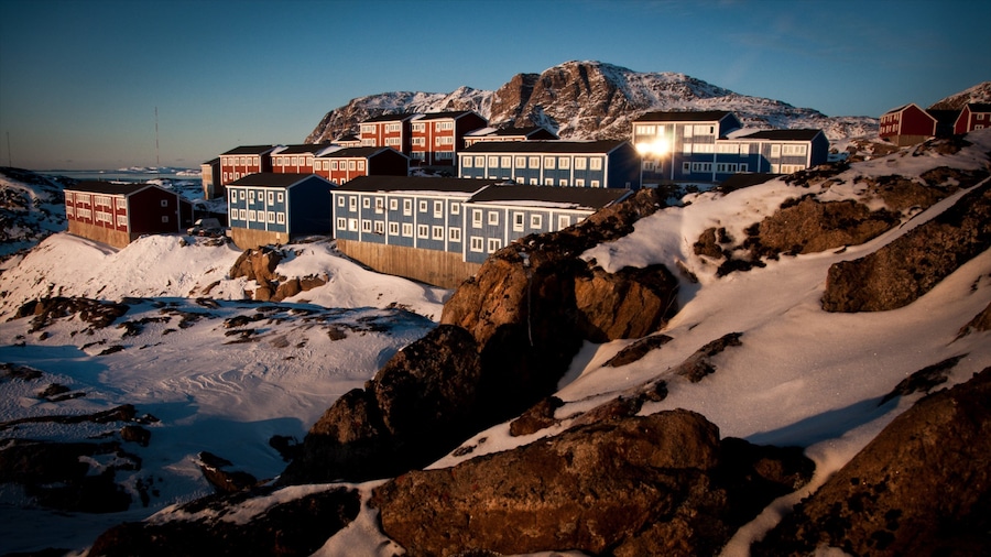 Sisimiut featuring a sunset, a small town or village and snow