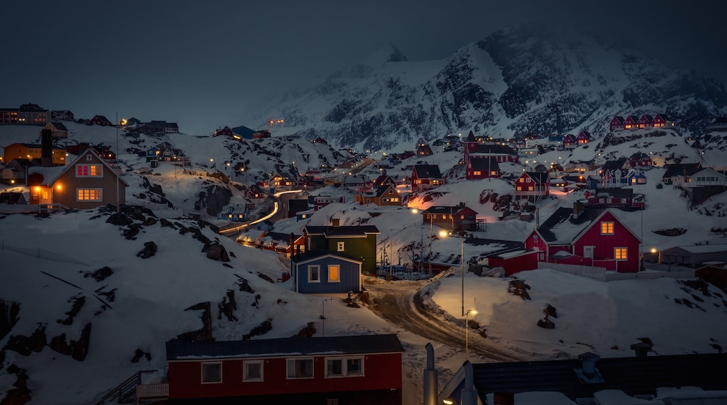 Sisimiut showing night scenes, mountains and a small town or village