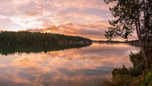 Panoramic landscape sunrise reflections on Filucy Bay, Puget Sound, Washington State Pacific Northwest