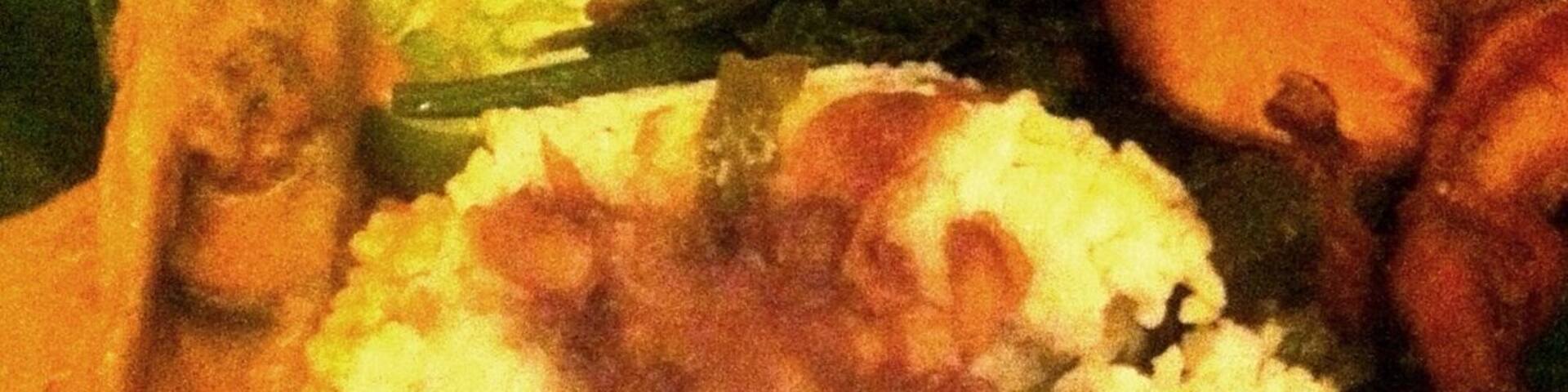 A legendary dish from Medan Baru restaurant: fish head soup - with rice and other condiments, including "sambal ganja" (chilli with ganja). A traditional dish from Medan, Indonesia.