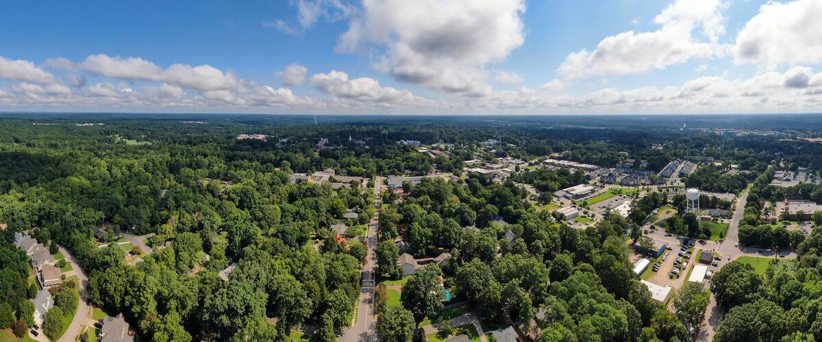 Wide Angle Panoramic Sunny Daytime Drone Image of Wake Forest, North Carolina, USA Featuring the Downtown Historic District, Businesses, and Residential Developments: Tourism, Real Estate, Travel