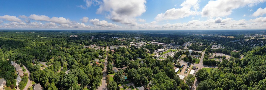 Wide Angle Panoramic Sunny Daytime Drone Image of Wake Forest, North Carolina, USA Featuring the Downtown Historic District, Businesses, and Residential Developments: Tourism, Real Estate, Travel