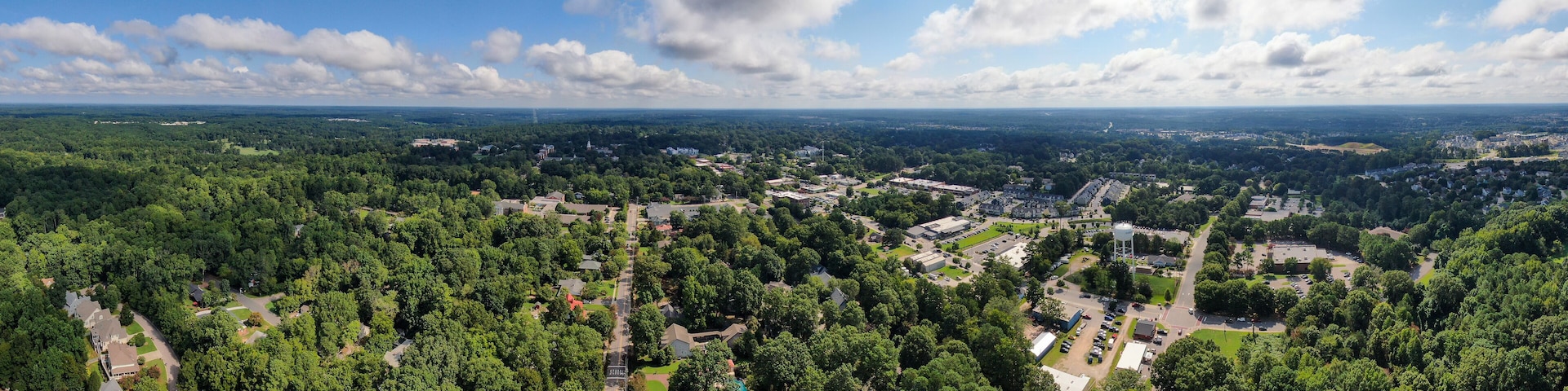 Wide Angle Panoramic Sunny Daytime Drone Image of Wake Forest, North Carolina, USA Featuring the Downtown Historic District, Businesses, and Residential Developments: Tourism, Real Estate, Travel
