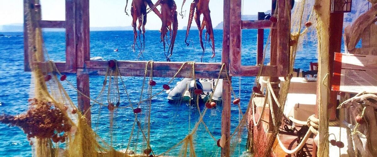 Ammoudi Fish Tavern down in the Bay on Mykonos Island. Freshest seafood meals with beautiful views. #Greece #Seafood #lifeatexpedia