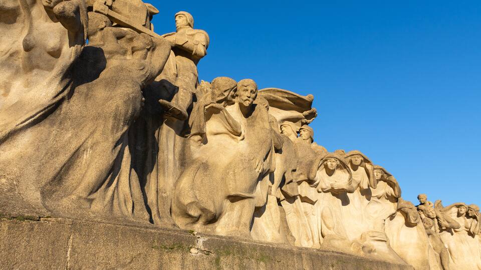 A large stone sculpture of a group of figures, likely representing a historical or religious scene.