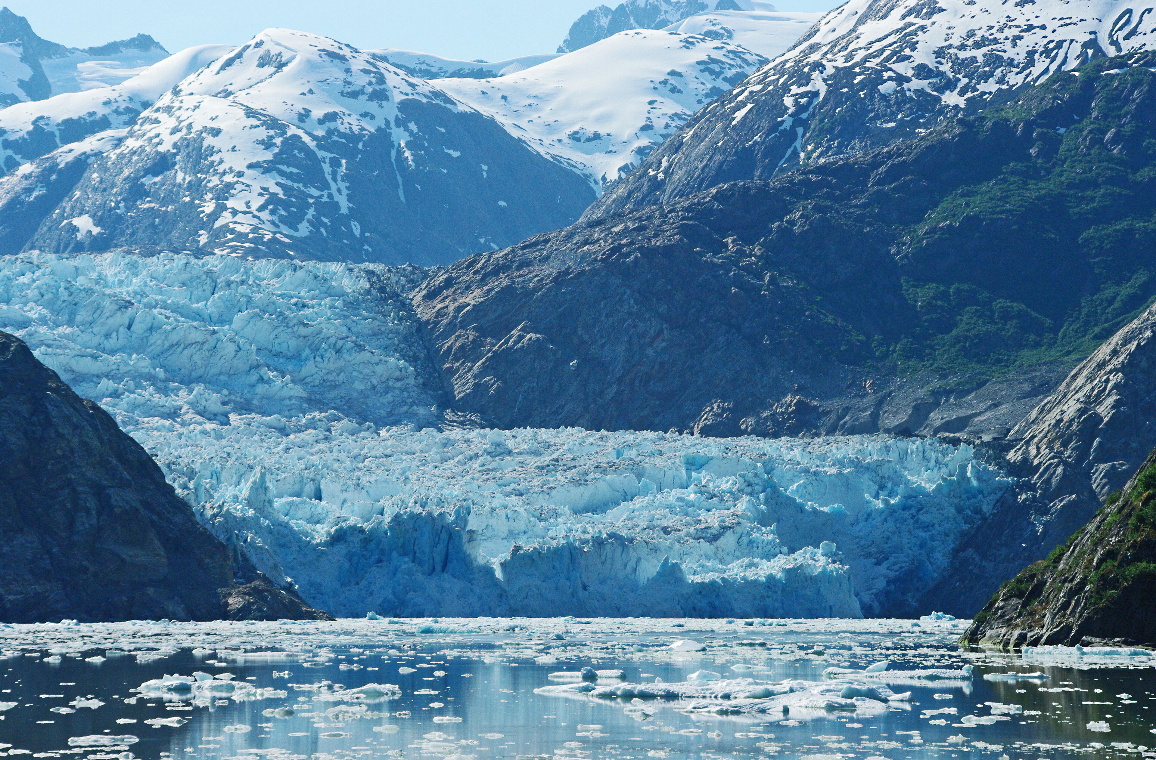 On a small ship cruise out of Juneau we encountered fantastic views like this on a regular basis. The ship was only 3 decks above the waterline.  Our cabin door let us out directly onto the second deck with the rail only feet away.  One morning we opened the door to this view. The Captain had parked the ship off this glacier while we slept. Boy, what a site to wake up to.
