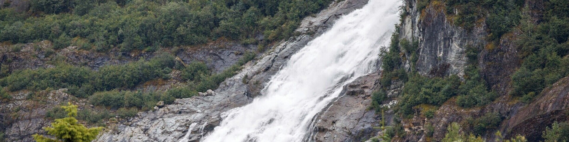 If you're in Juneau Alaska, I'm sure you will visit Mendenhall Glacier National Park. This is a pic of Nuggett Falls from a distance with all the visitors in the front to give a perspective of the power and size of the Falls. Be prepared for crowds if you're there in the summer.