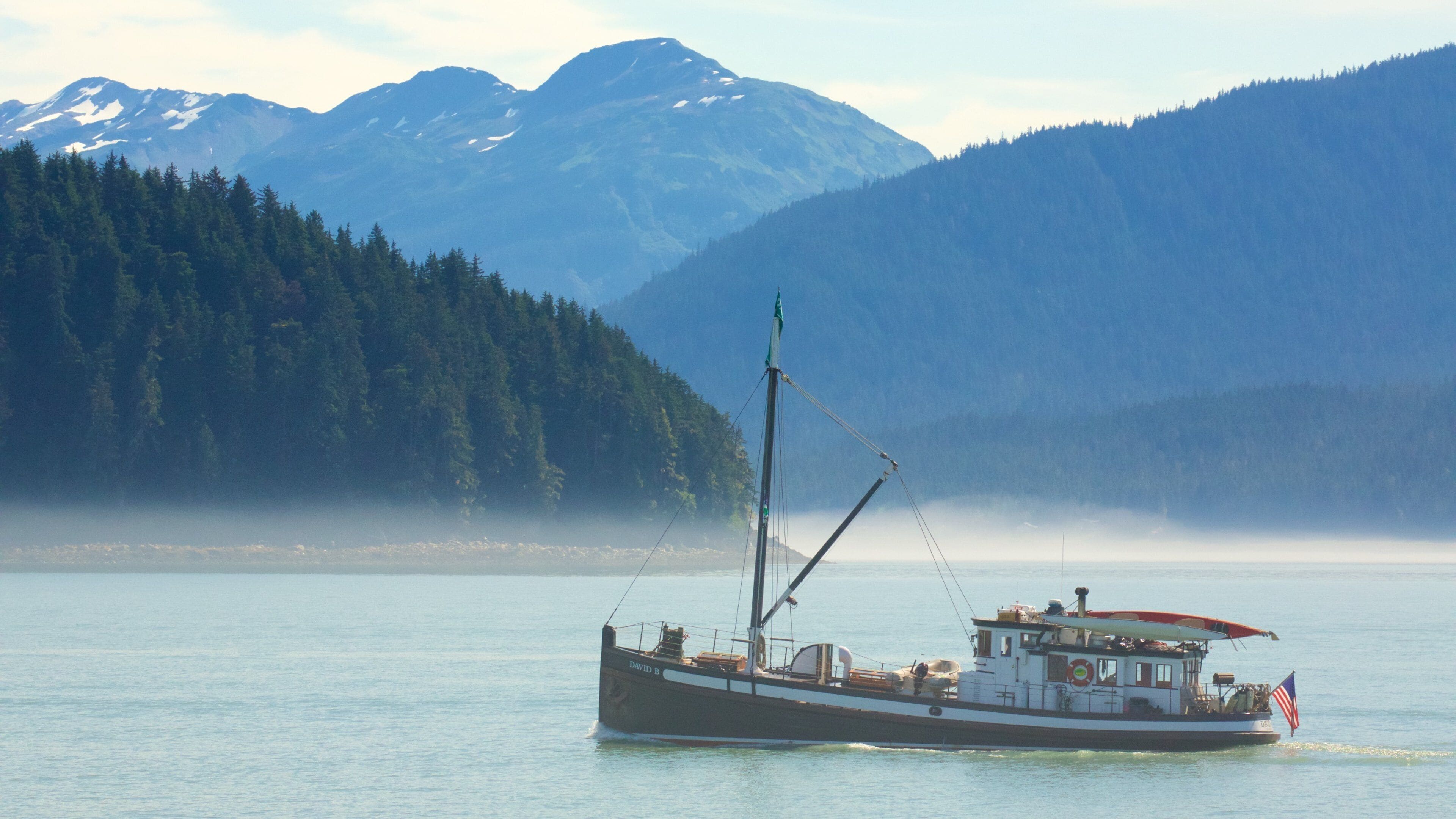 Alaska which includes mist or fog, boating and general coastal views
