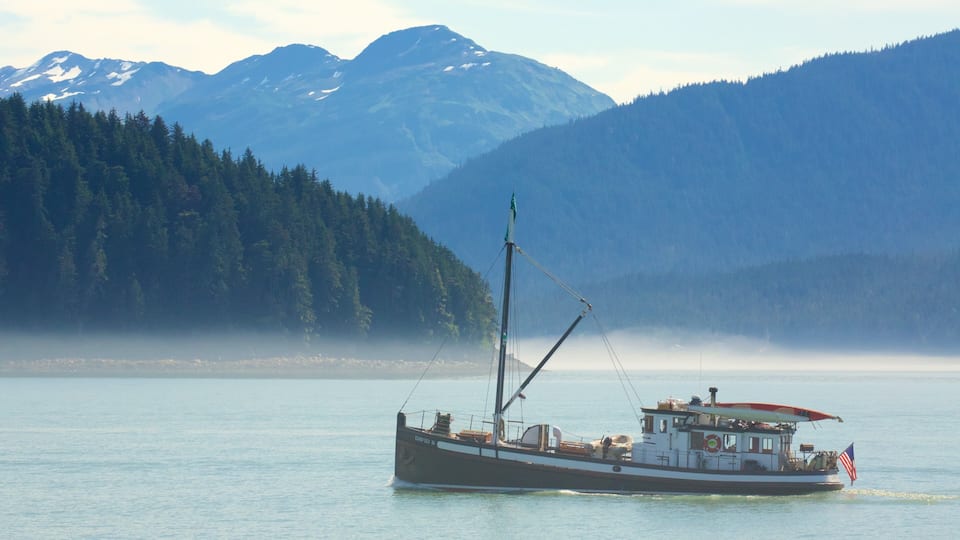 Alaska which includes mist or fog, boating and general coastal views