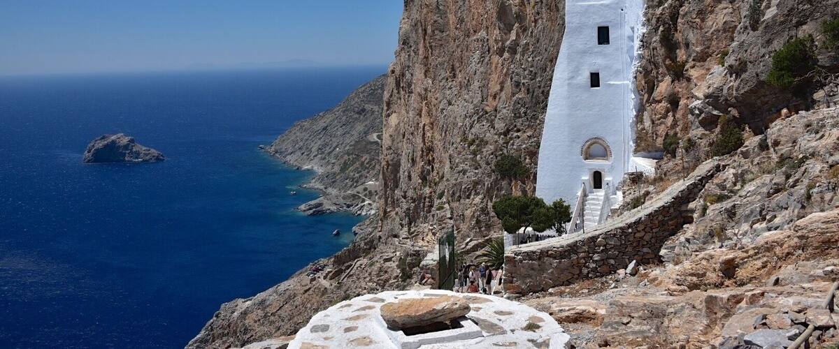 Amorgos Island-Cyclades.
The monastery looks like hanging off the cliff. The white-washed Monastery of Panagia Hozoviotissa stands there since 1088, when it was founded. The occasion for building it was an icon found, coming from Hozovo or Hozova of Palestine.
Tradition speaks of a woman in Asia at the time of iconoclasm, who threw the icon of the Virgin Mary into the sea so as not to be destroyed. The icon arrived at Agia Anna and the islanders just found it and decided to build a church there.
