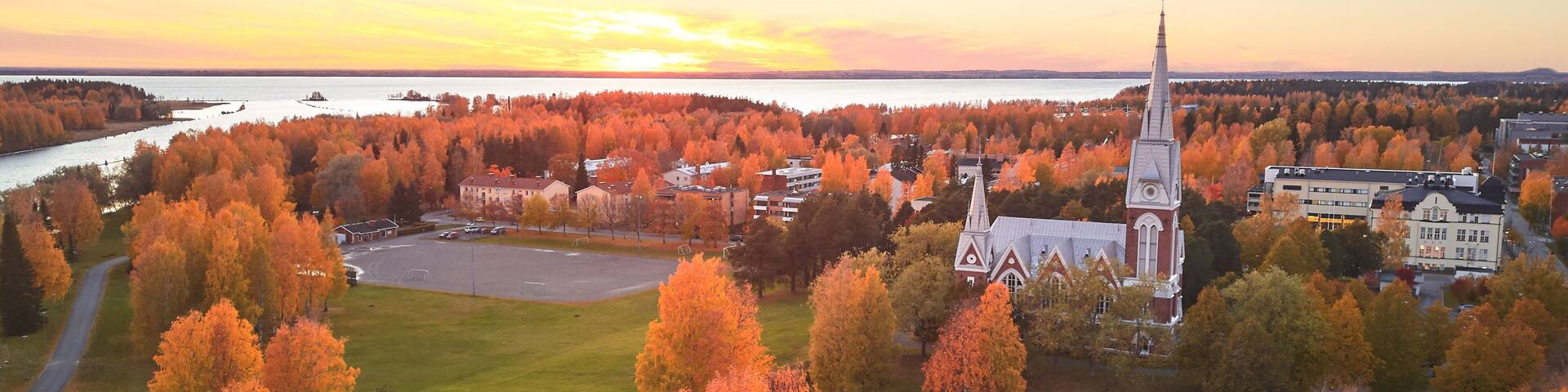 Aerial view of Joensuu Church. Autumn cityscape at sunset.