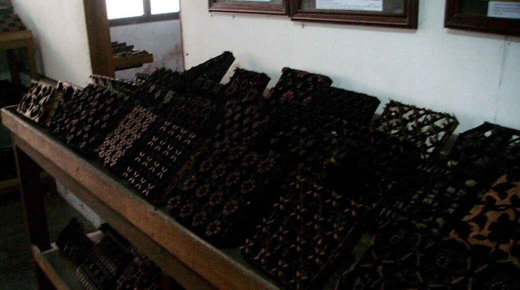 Copper stamps are used to apply hot wax onto the batik fabric. They are handmade of copper strips, carefully cut, shaped and soldered into fabulous shapes and patterns. They are used by Batik artists in Java by dipping them into hot wax, shaking off the excess, and then stamping the wax onto the cloth. Aligning the edges of each consecutive stamp creates patterns which run the length and width of the fabric.