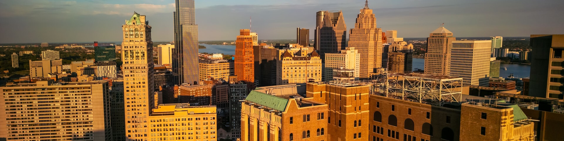 A cityscape with a variety of architectural styles, including modern skyscrapers and older, ornate buildings.