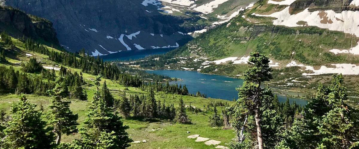 Hidden Lake Overlook is a short hike from Logan Pass, located along the Going-to-the-Sun Road in Glacier National Park. In mid-July we were hiking through snow in some areas, but it wasnât bad. The turquoise colored water is like nothing Iâve seen before.