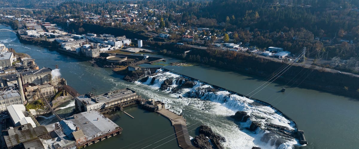 The Willamette Falls is a natural waterfall between West Linn and Oregon City, not far south of Portland, Oregon. By volume, this is the largest waterfall in the Northwestern United States.