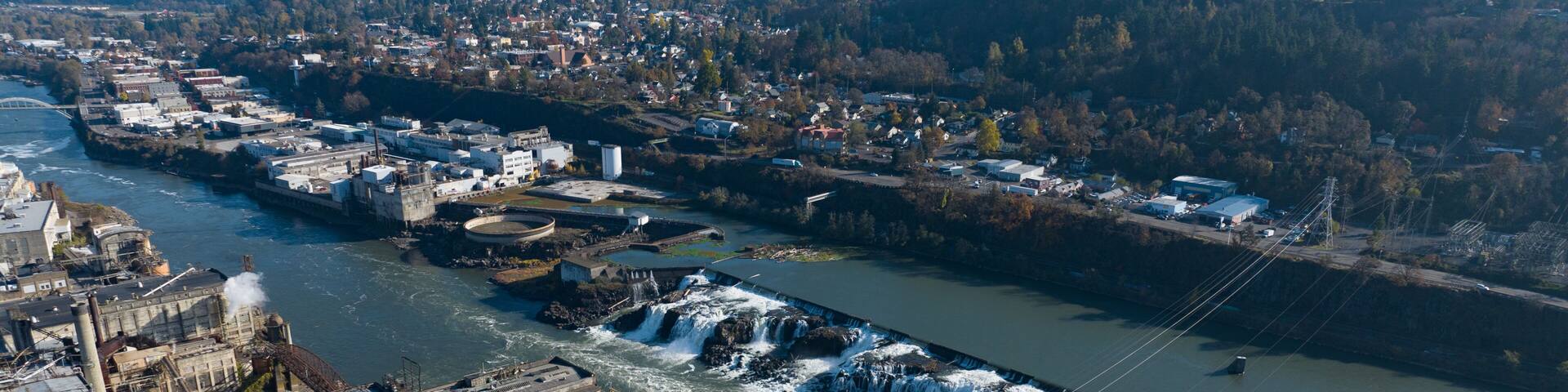 The Willamette Falls is a natural waterfall between West Linn and Oregon City, not far south of Portland, Oregon. By volume, this is the largest waterfall in the Northwestern United States.